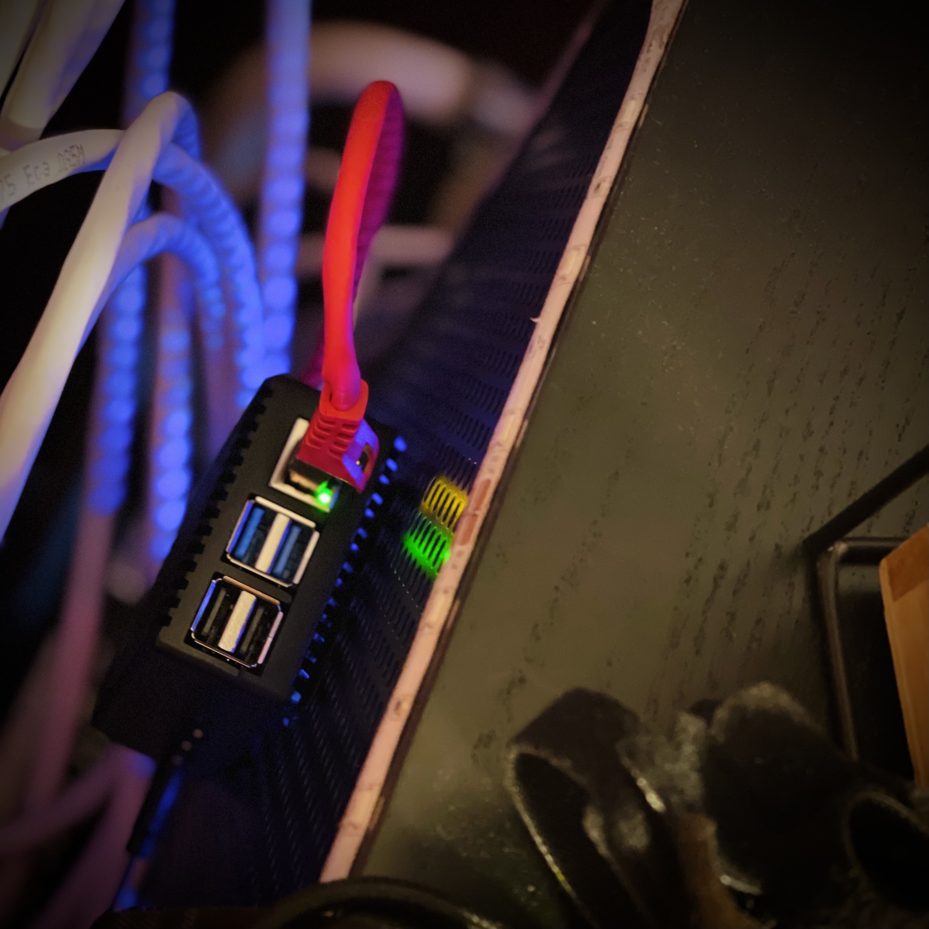 Raspberry Pi attached to back of the cabinet with velcro-tape